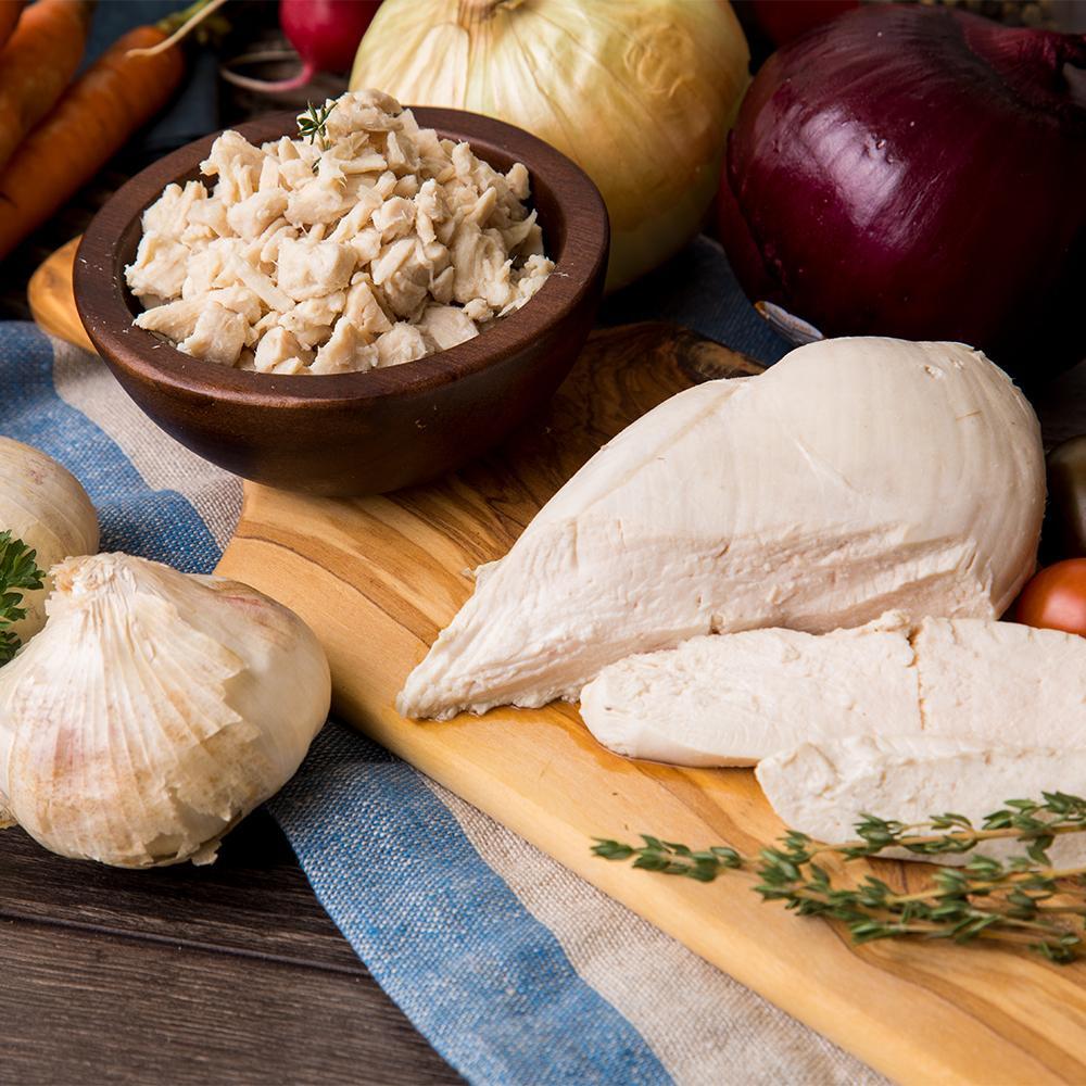 ready hour mega protein kit chicken diced in wooden bowl with onion and chicken at sided