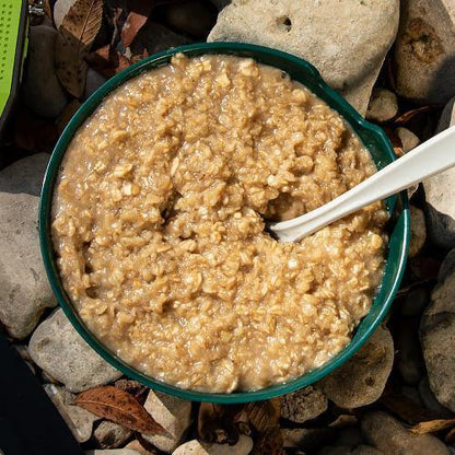 ready hour maple grove oatmeal in green dish with spoon inside