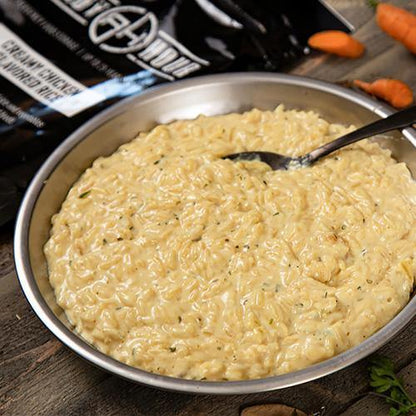 creamy chicken flavored rice in silver dish